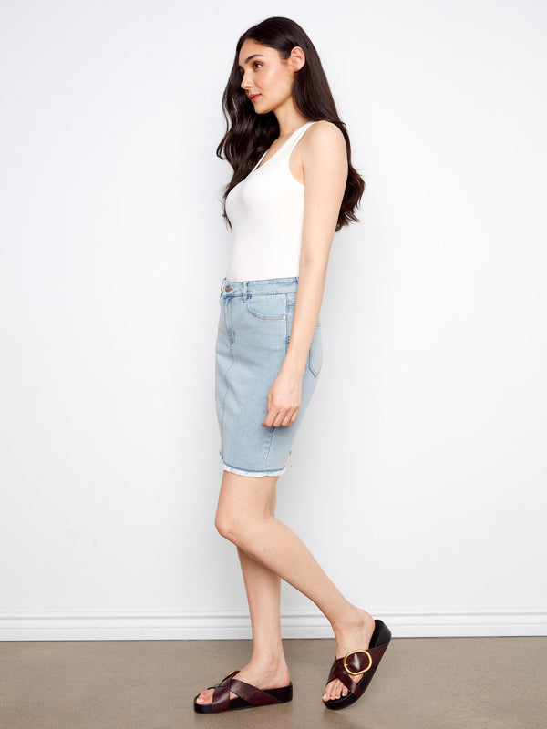 This stretch denim skirt offers comfort and flexibility, perfect for any occasion. By Charlie B.