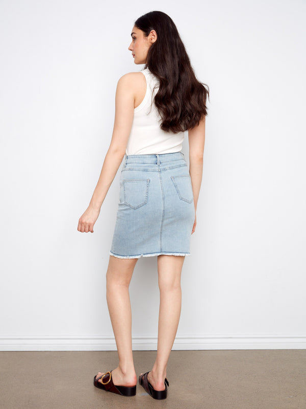 A versatile denim skirt featuring five pockets, blending style and functionality effortlessly. By Charlie B.