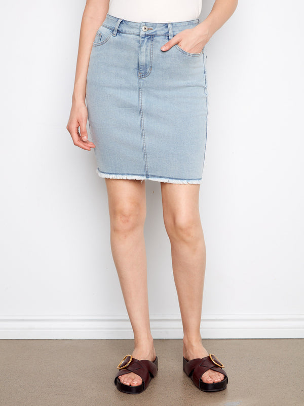 Chic denim skirt with a frayed edge finish for an edgy yet refined appearance. By Charlie B.