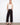 Black pants with a wide leg fit and cropped length, showcasing patch pockets. Designed for style and comfort by Charlie B.