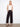 Black pants with a wide leg fit and cropped length, showcasing patch pockets. Designed for style and comfort by Charlie B.
