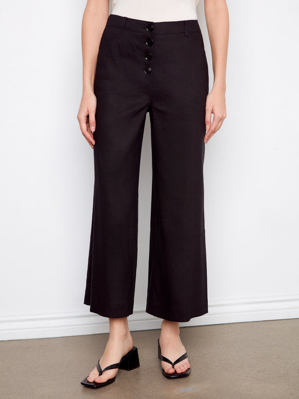 These black pants feature a regular waist rise and stretch linen fabric, perfect for everyday wear by Charlie B.