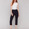 Black capri pants with a slim leg silhouette and stretch fabric by Charlie B.
