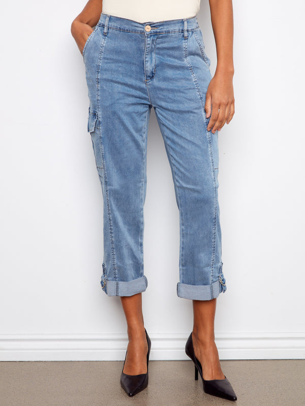 Designed with adjustable hems and button tabs, these jeans offer versatility in style and fit. Two cargo pockets add functionality by Charlie B.