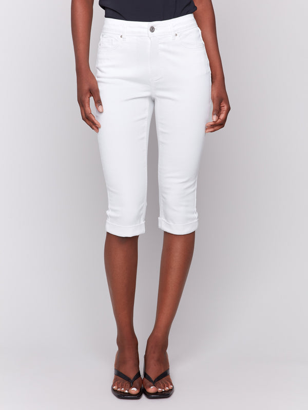 White pedal pusher pants featuring a slim fit and mid-rise waist by Charlie B.