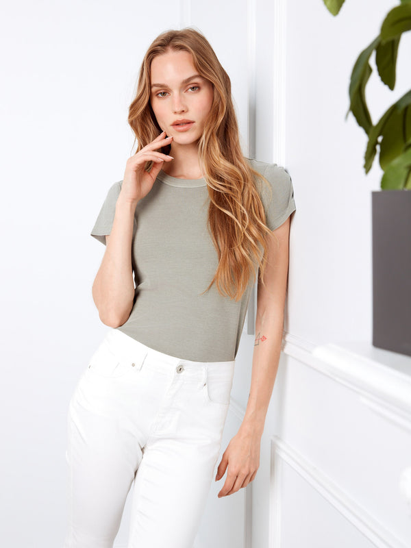 Cuffed hem adds a chic touch to these versatile white stretch twill capri pants by Charlie B.