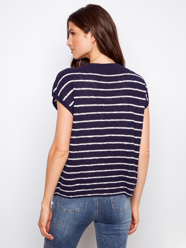 Navy and white striped top in breathable knit fabric, ideal for layering or wearing alone. Designed with a classic crew neckline by Charlie B.
