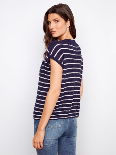Elegant striped pattern on soft knit fabric, complemented by drop cap sleeves. A versatile piece suitable for any wardrobe by Charlie B.