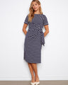 Navy striped dress with a classic boat neckline, featuring short sleeves and a chic tie waist by Charlie B.
