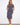Navy striped dress with a classic boat neckline, featuring short sleeves and a chic tie waist by Charlie B.