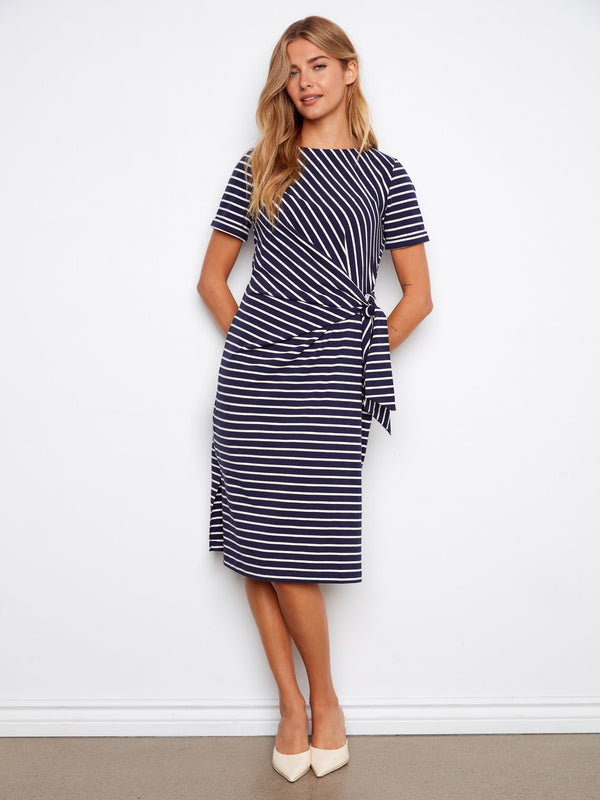 Navy striped dress with a classic boat neckline, featuring short sleeves and a chic tie waist by Charlie B.