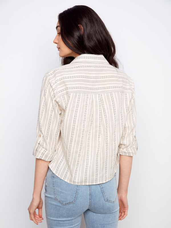 The elegant design of this striped shirt is highlighted at the back, showcasing its chic simplicity and comfortable fit by Charlie B.