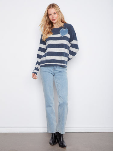 Stylish heather denim striped sweater, highlighted by its unique heart patch embroidery and relaxed fit by Charlie B.