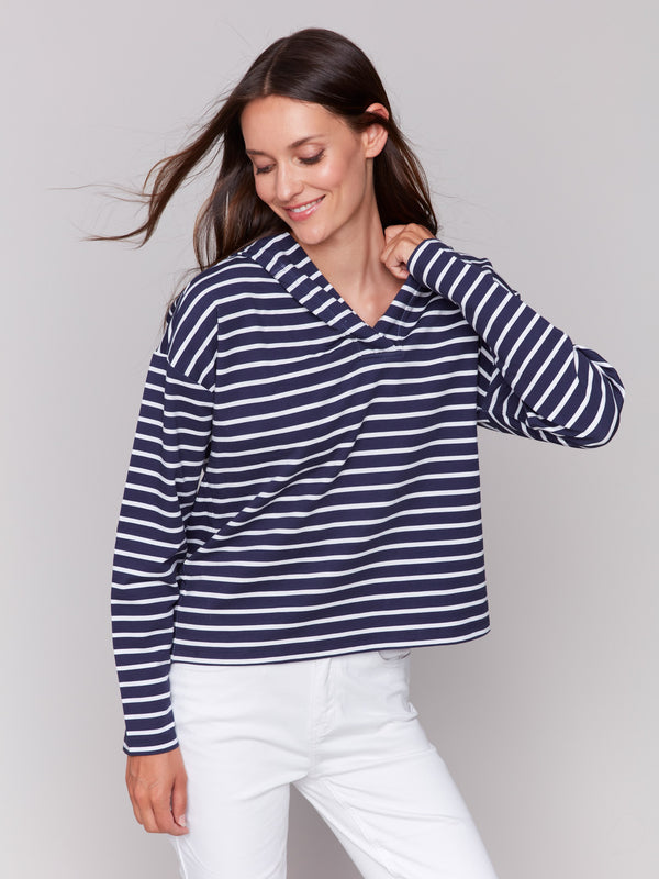 Fashionable drop shoulder style on a hoodie by Charlie B.