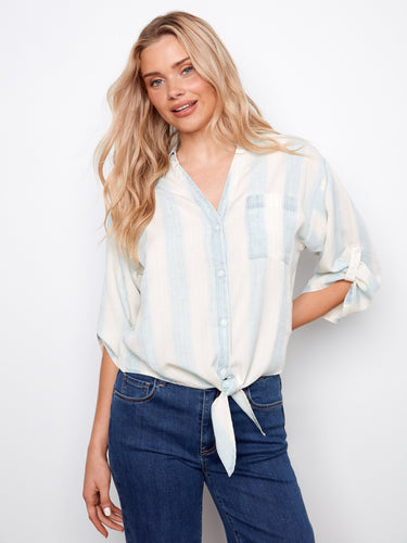 Chic blouse showcasing a convenient chest pocket, blending functionality with style in one garment. Made by Charlie B.