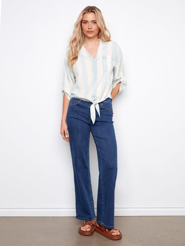 Stylish outfit combined with denim jeans, creating an effortlessly chic ensemble. By Charlie B.