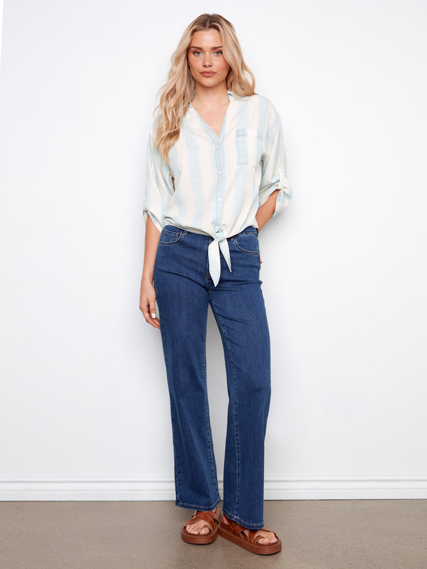 Stylish outfit combined with denim jeans, creating an effortlessly chic ensemble. By Charlie B.