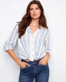 The shirt features a classic shirt collar, enhancing its timeless appeal. The striped pattern adds a touch of elegance. By Charlie B.