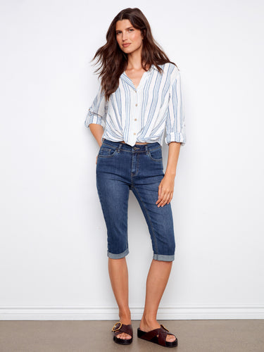 This piece has a button-front closure, offering versatility and ease of wear. Ideal for any casual outing. By Charlie B.