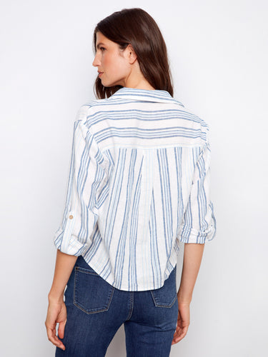 Designed with roll-up sleeves and button tabs, this shirt provides adjustable comfort and style options. By Charlie B.