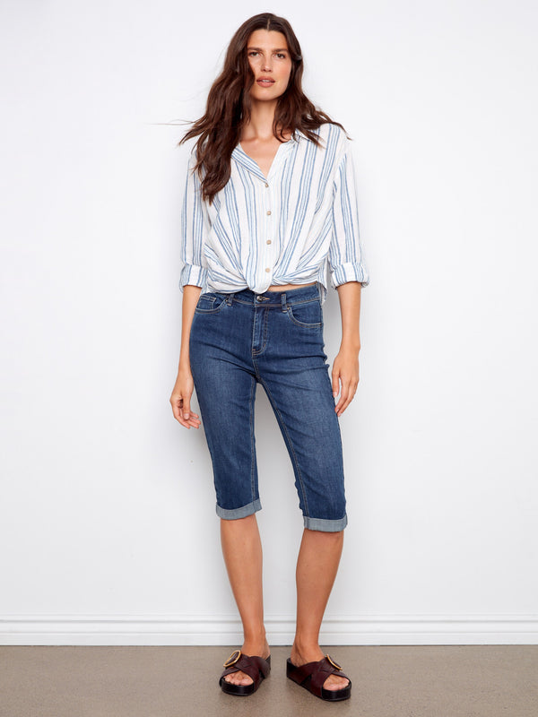 Crafted with attention to detail, the button-front closure adds practicality while maintaining style integrity. By Charlie B.