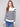 Offwhite striped sweater with a stylish mock neck design and elegant button details by Charlie B.