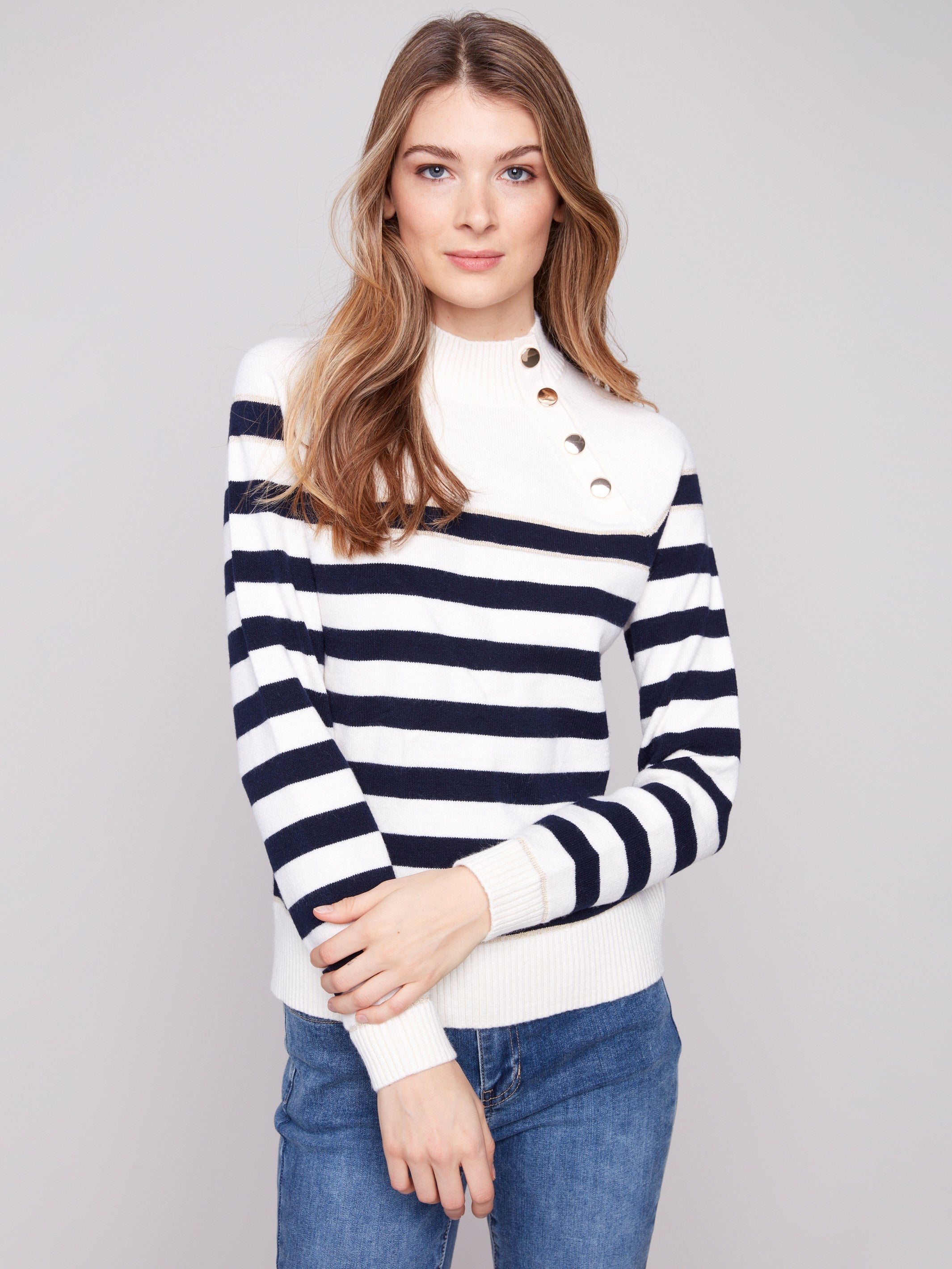 Striped sweater in offwhite with eye-catching button details at the neck for added flair by Charlie B.