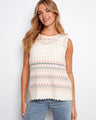 Crochet top with a crew neckline and multicolor stripes, ideal for warm days. Crafted for comfort and style by Charlie B.