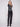 Chic sleeveless black sweater vest with classic white stripes for versatile styling options by Charlie B.