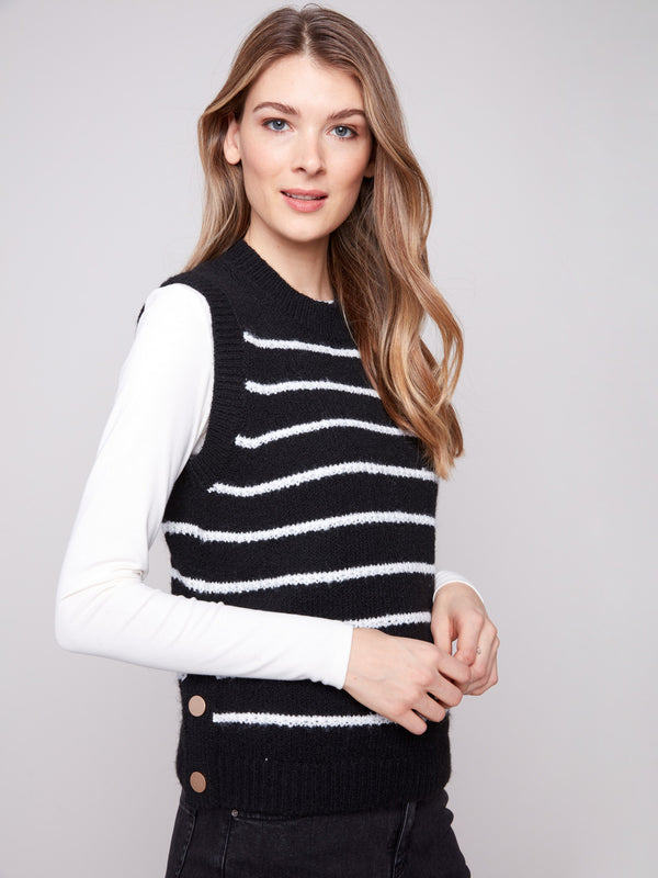 Stylish black sweater vest adorned with snap button details and elegant white horizontal stripes by Charlie B.