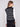 Elegant black and white striped design on a sleeveless sweater vest, perfect for layering by Charlie B.