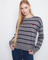Striped sweater with a classic crew neck design, featuring ribbed cuffs and hem for added comfort. By Charlie B.
