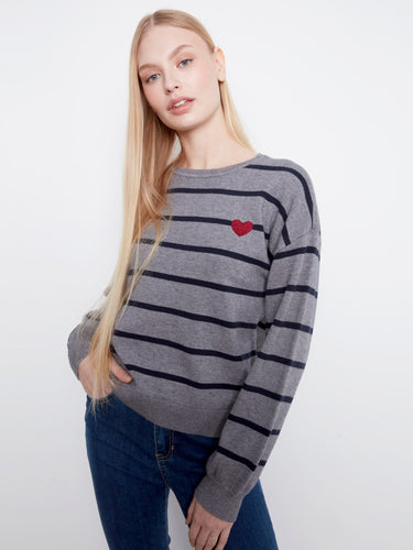 Chic sweater with ribbed cuffs and hem, offering a snug fit while maintaining style. By Charlie B.