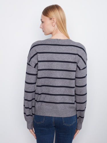 Elegant long-sleeve striped top with ribbed details at the cuffs and hem for enhanced style. By Charlie B.
