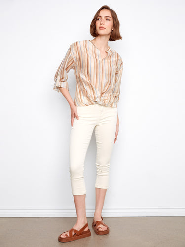 This top showcases roll-up sleeves, adding versatility and casual charm to your wardrobe. By Charlie B.