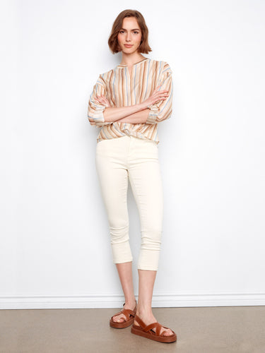 The twist front design gives this top a unique and modern flair, perfect for elevating your style. By Charlie B.