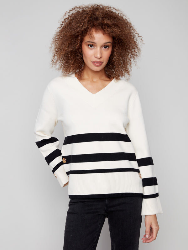 Ecru sweater with striped pattern and V-neck design, highlighted by wide cuffs for a stylish touch by Charlie B.
