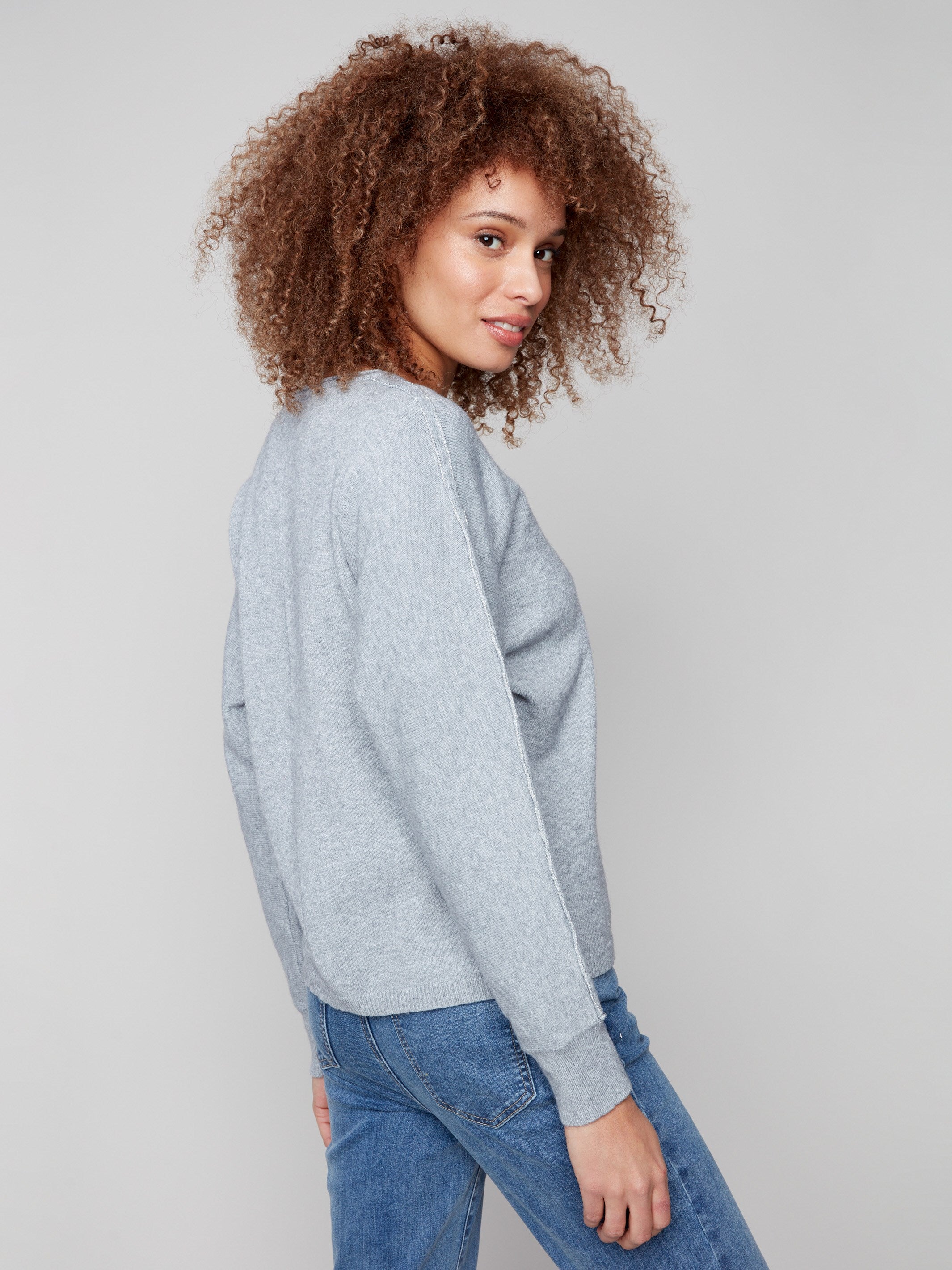 Elegant heather grey sweater with ribbed cuffs and a chic metallic sleeve accent by Charlie B.