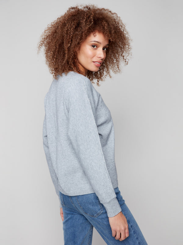 Elegant heather grey sweater with ribbed cuffs and a chic metallic sleeve accent by Charlie B.