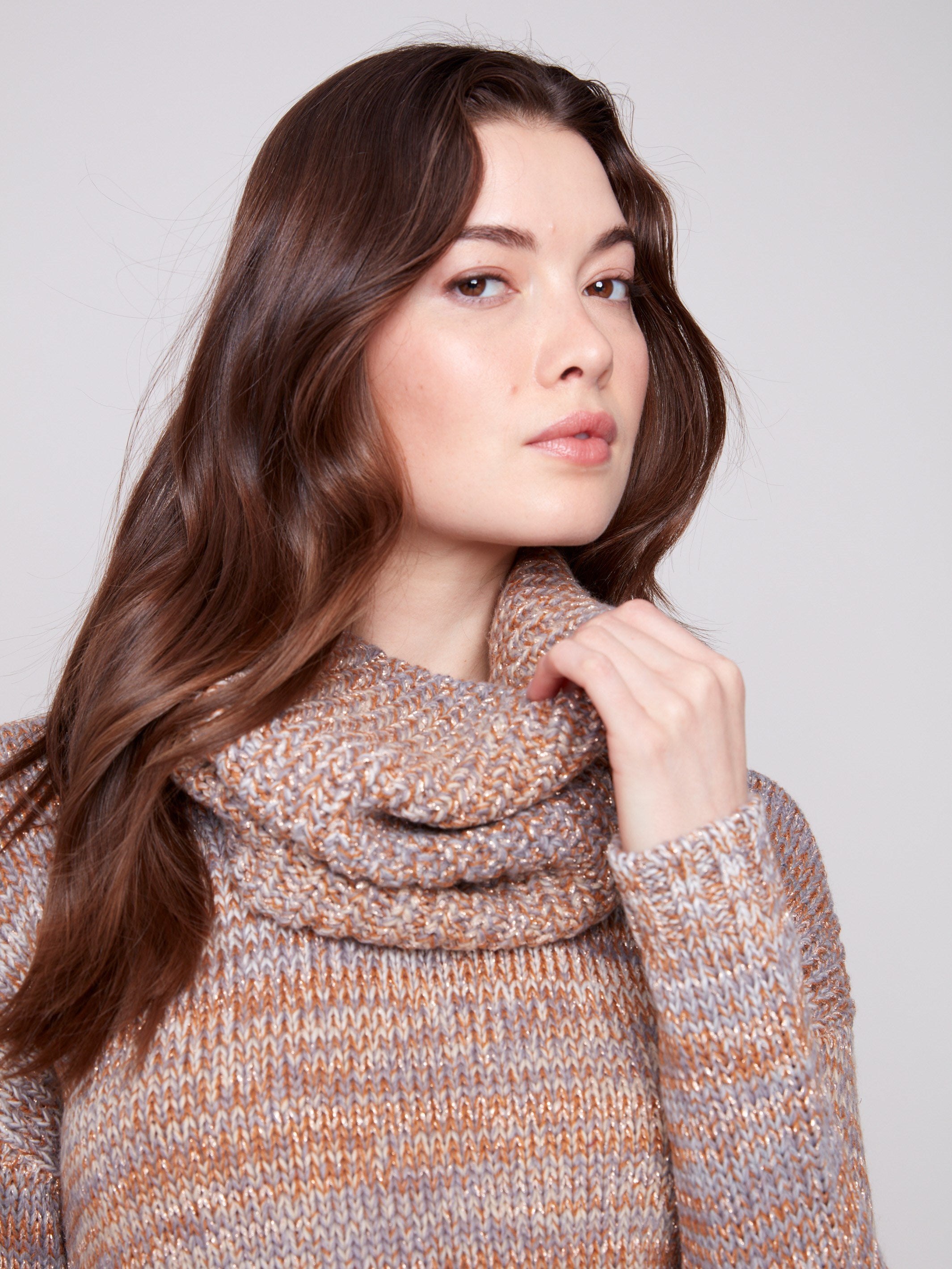 Close-up of the fog-colored sweater highlighting the removable scarf and subtle metallic detail by Charlie B.