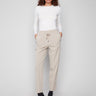 Greige slim-leg techno pants with a relaxed fit, featuring pull-on style and side zip pockets for convenience by Charlie B.