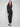 Black slim-leg techno pants designed with an elastic waistband and practical side zip pockets by Charlie B.