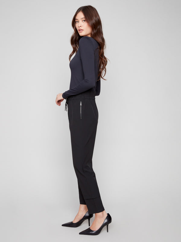 Slim-leg black techno pants with a stylish pull-on design and adjustable drawstring waist by Charlie B.