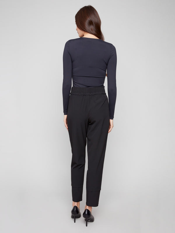 Elegant black slim-leg pants, crafted with side zip pockets for added convenience by Charlie B.