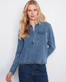 Stylish denim shirt featuring a classic shirt collar and crafted from stretch Tencel for comfort. Perfect for any casual outing. By Charlie B.