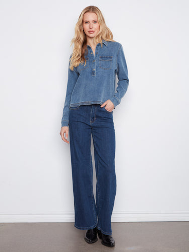This versatile denim shirt includes practical flap pockets, adding functionality to its chic design. A wardrobe must-have. By Charlie B.