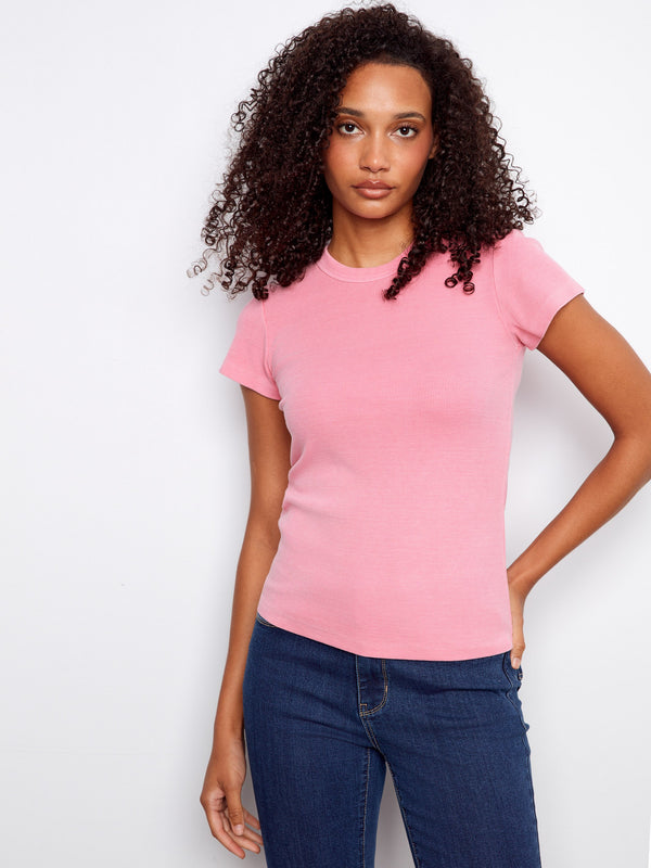 Stylish pink top with a semi-fitted cut and ribbed texture, complemented by an elegant crew neck detail by Charlie B.