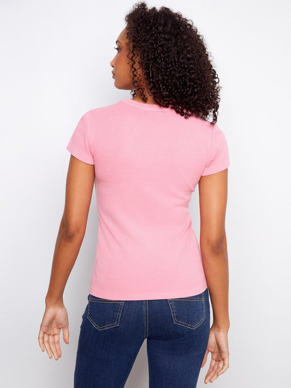 Chic pink shirt showcasing a classic crew neck and ribbed texture, designed for a flattering semi-fitted look by Charlie B.