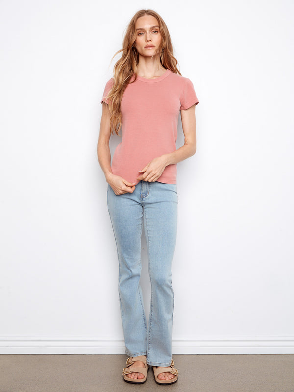 Crew neck design elevates this carnation T-shirt, offering a timeless and chic look by Charlie B.