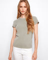 This semi-fitted top features a classic crew neck design, offering a timeless appeal for any casual outfit by Charlie B.